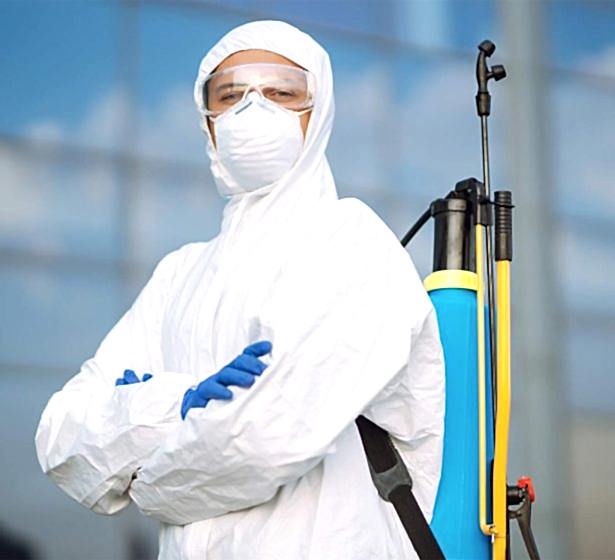 disinfecting-to-prevent-covid-19-man-in-protectiv-2025-03-05-05-32-49-AYUVLQG.jpg